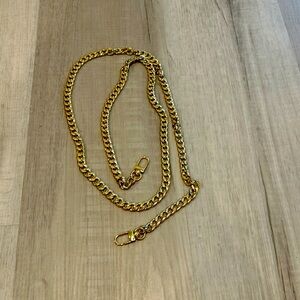 Long unbranded gold chain.